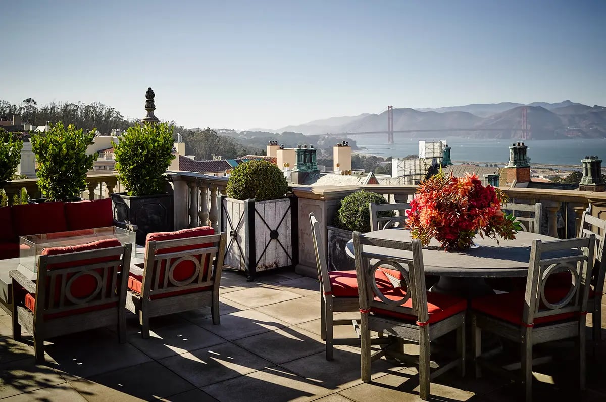 Ken Fulk's outdoor design blends traditional and contemporary aesthetics, with the Golden Gate Bridge in the background