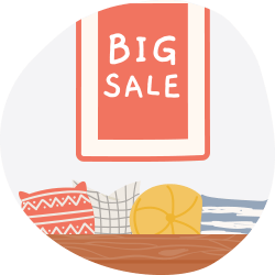 BIG SALE sign above a sofa with patterned and yellow cushions.