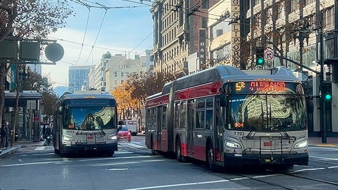 A Muni Metro light rail train arriving at a station in Hayes Valley, San Francisco.