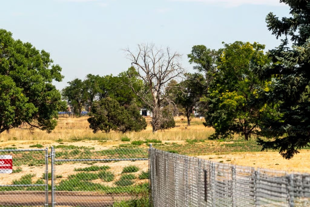 Fenced-off Park Hill Golf Course in Denver awaiting redevelopment into a future public park