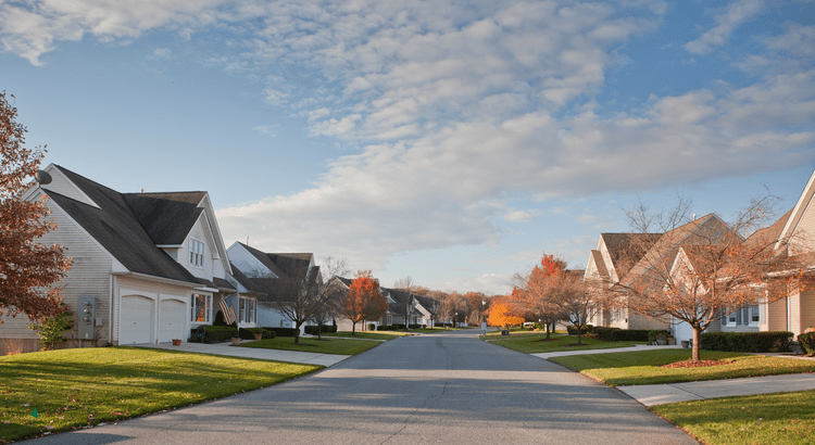 A row of colorful houses lined up along a street, showcasing diverse architectural styles and vibrant facades.