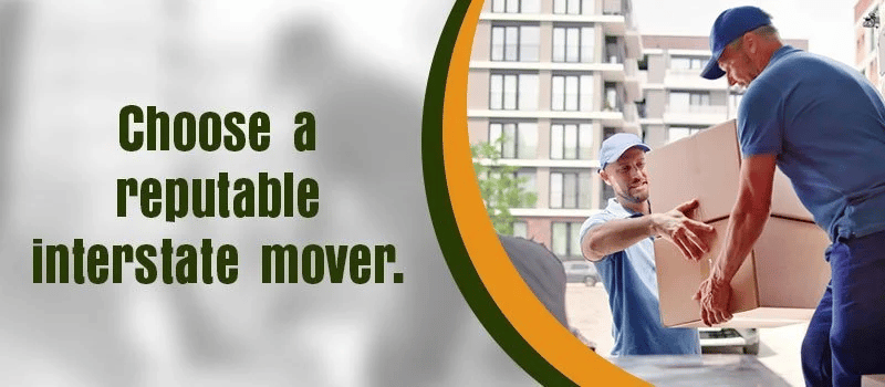 Choose a reputable interstate mover; two movers carry a box outside a modern building.
