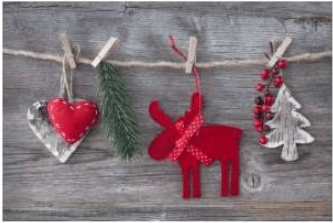 Holiday ornaments hanging from twine, including a red reindeer and heart.