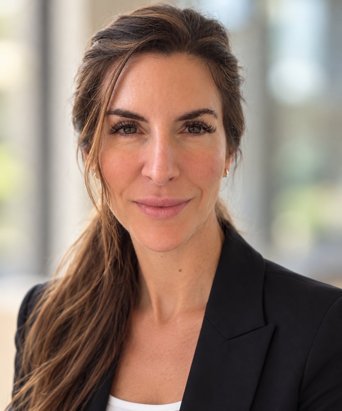 Angela Trimmis, PH Realty Group real estate agent, wearing a black blazer.
