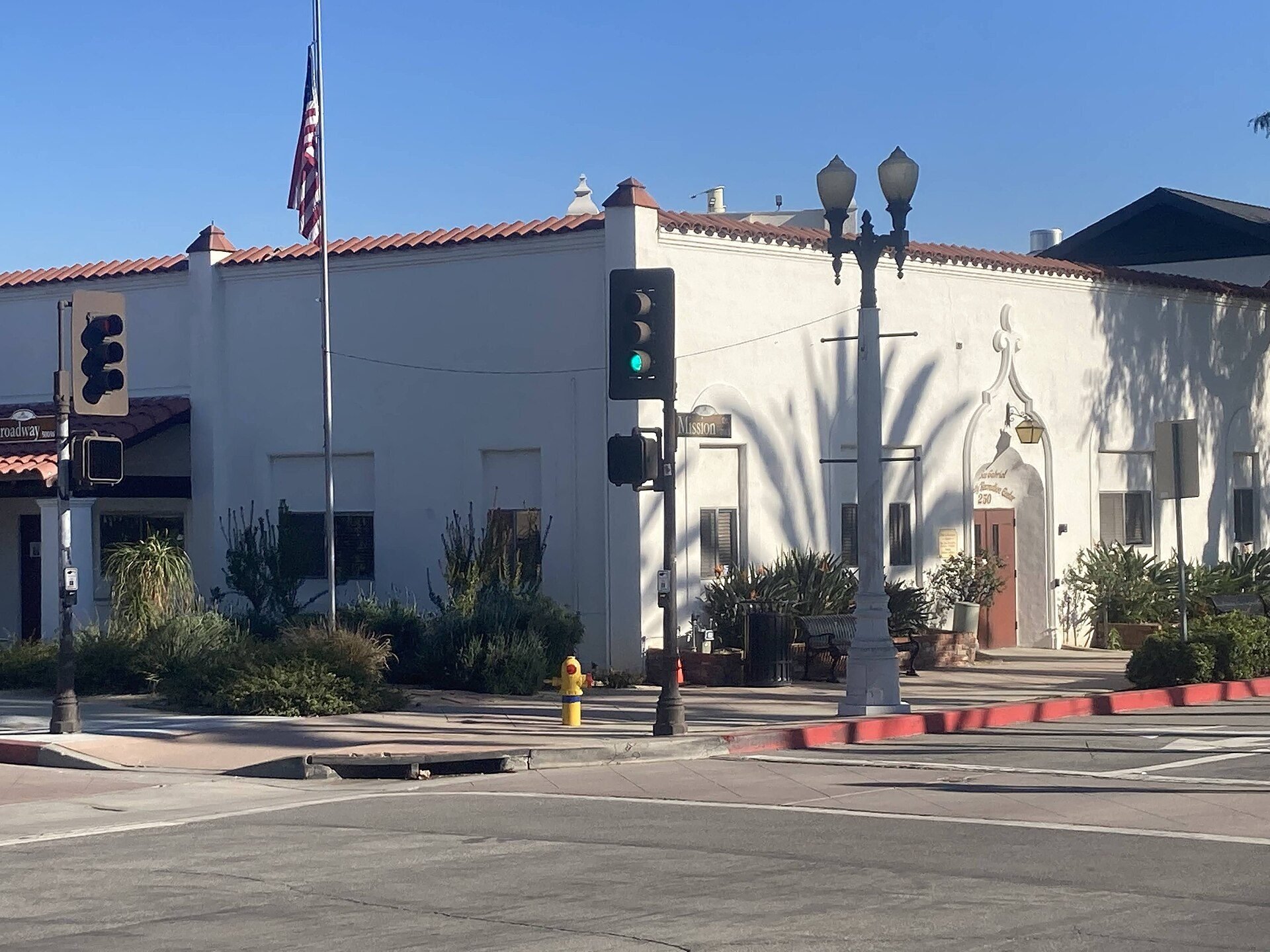 Mission Drive street corner and Spanish-inspired building exterior in San Gabriel, photographed January 2023