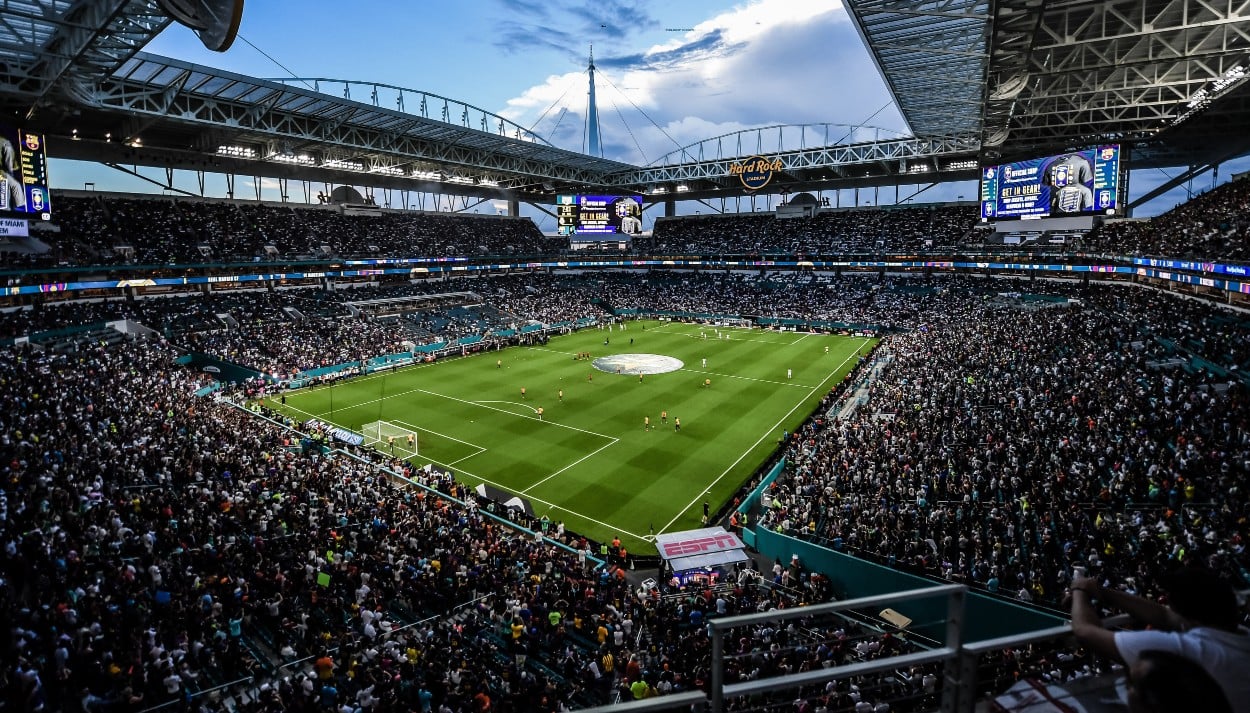 Crowded Hard Rock Stadium during a soccer match, viewed from high in the stands.