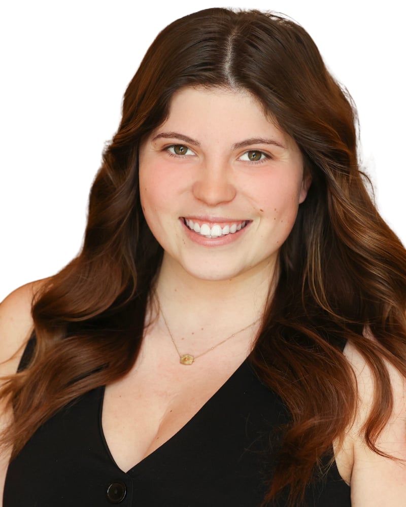 Alexa Marie “Lexi” Lemus, smiling with long, wavy brown hair.