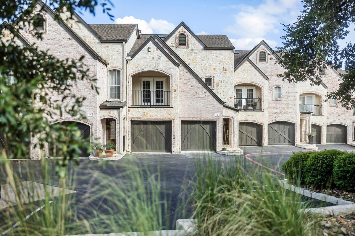 Stone and stucco front elevation with attached garages, Barton Hollow, Westlake, Austin.