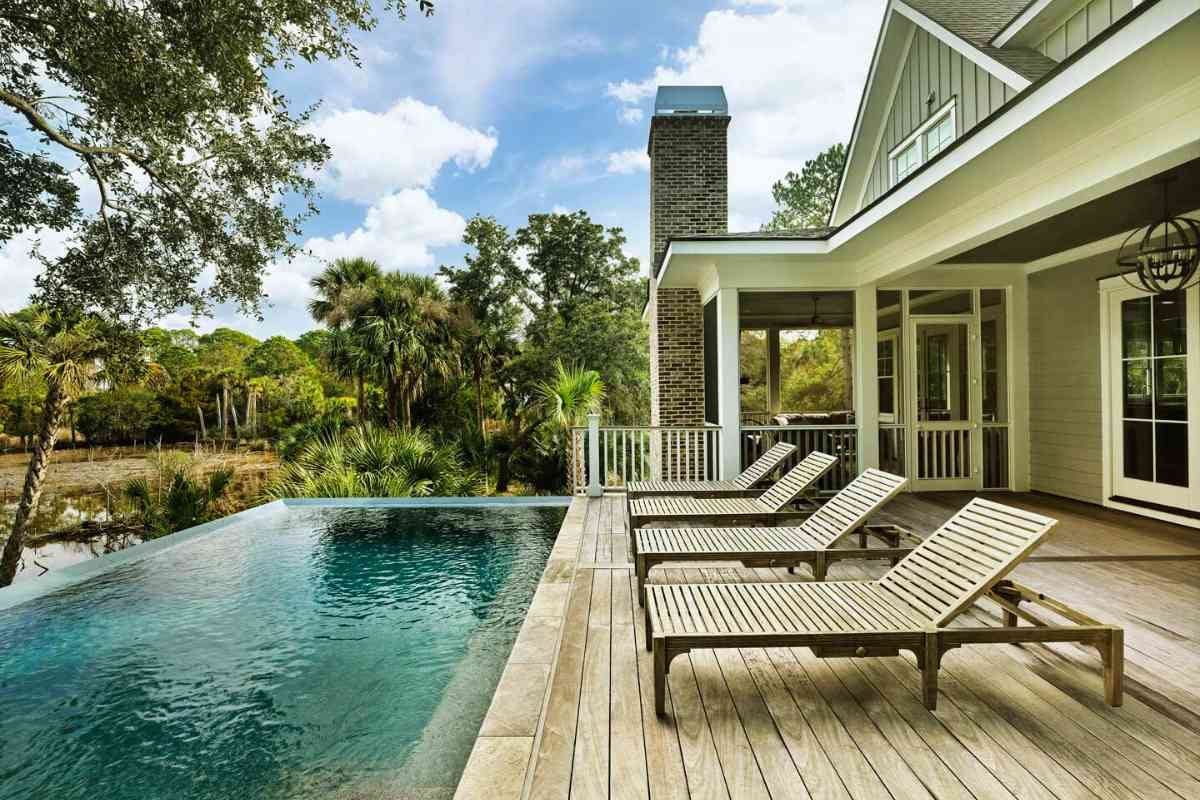Infinity pool overlooking lush marsh at a Charleston luxury home