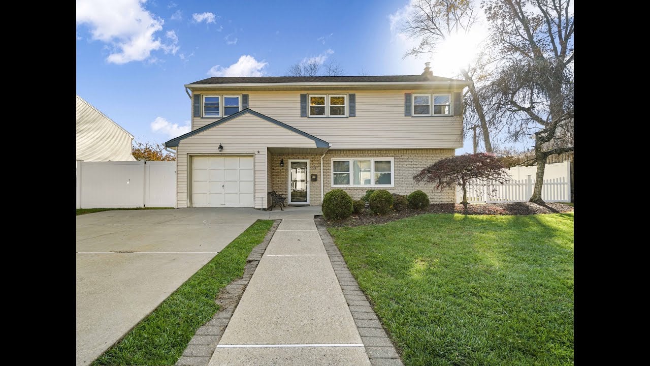Impeccably renovated & beautifully maintained home in the desirable White Beeches section of Dumont!