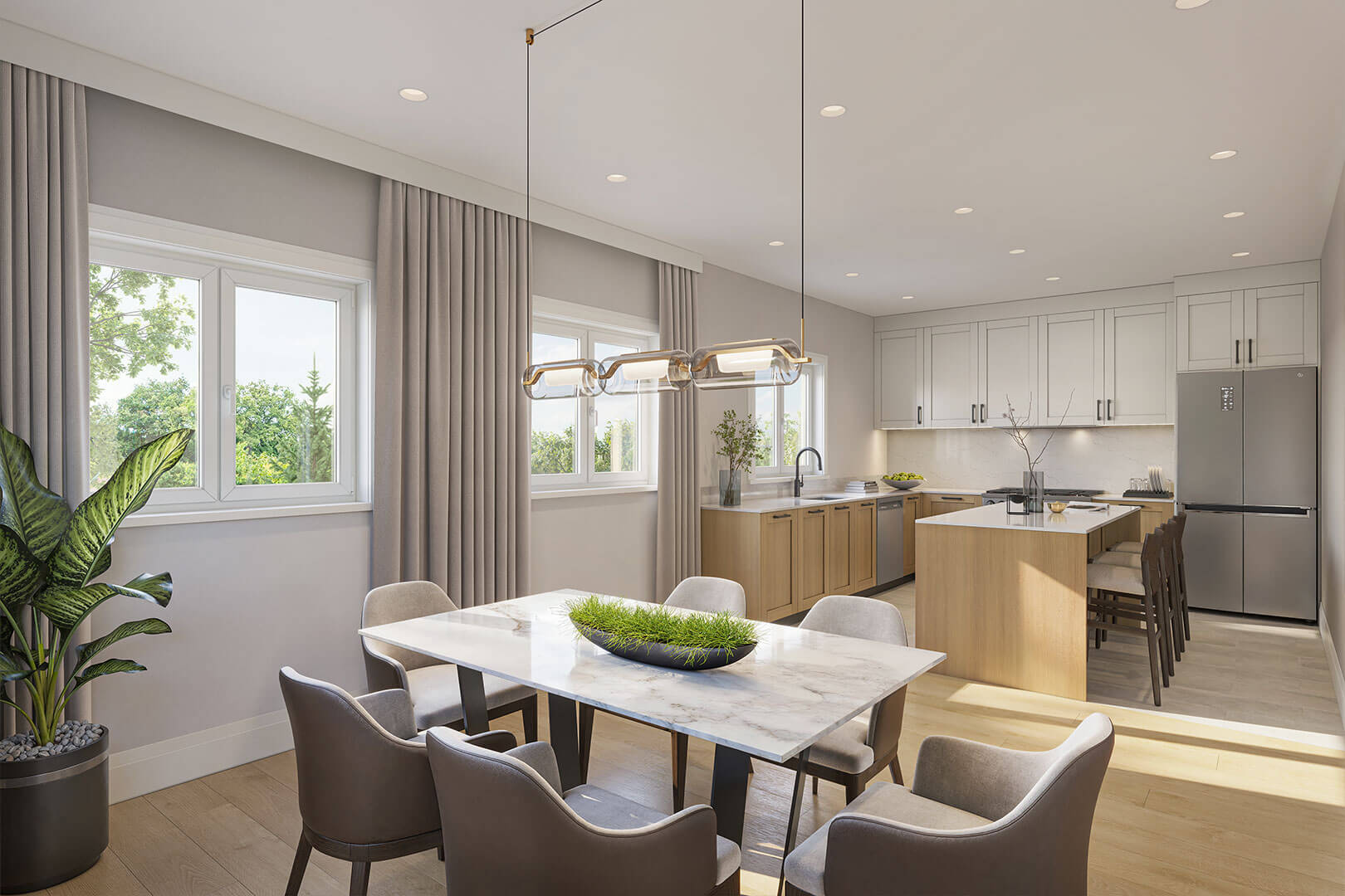 Staged kitchen and dining area with a marble table, light wood island, and large curtained windows.