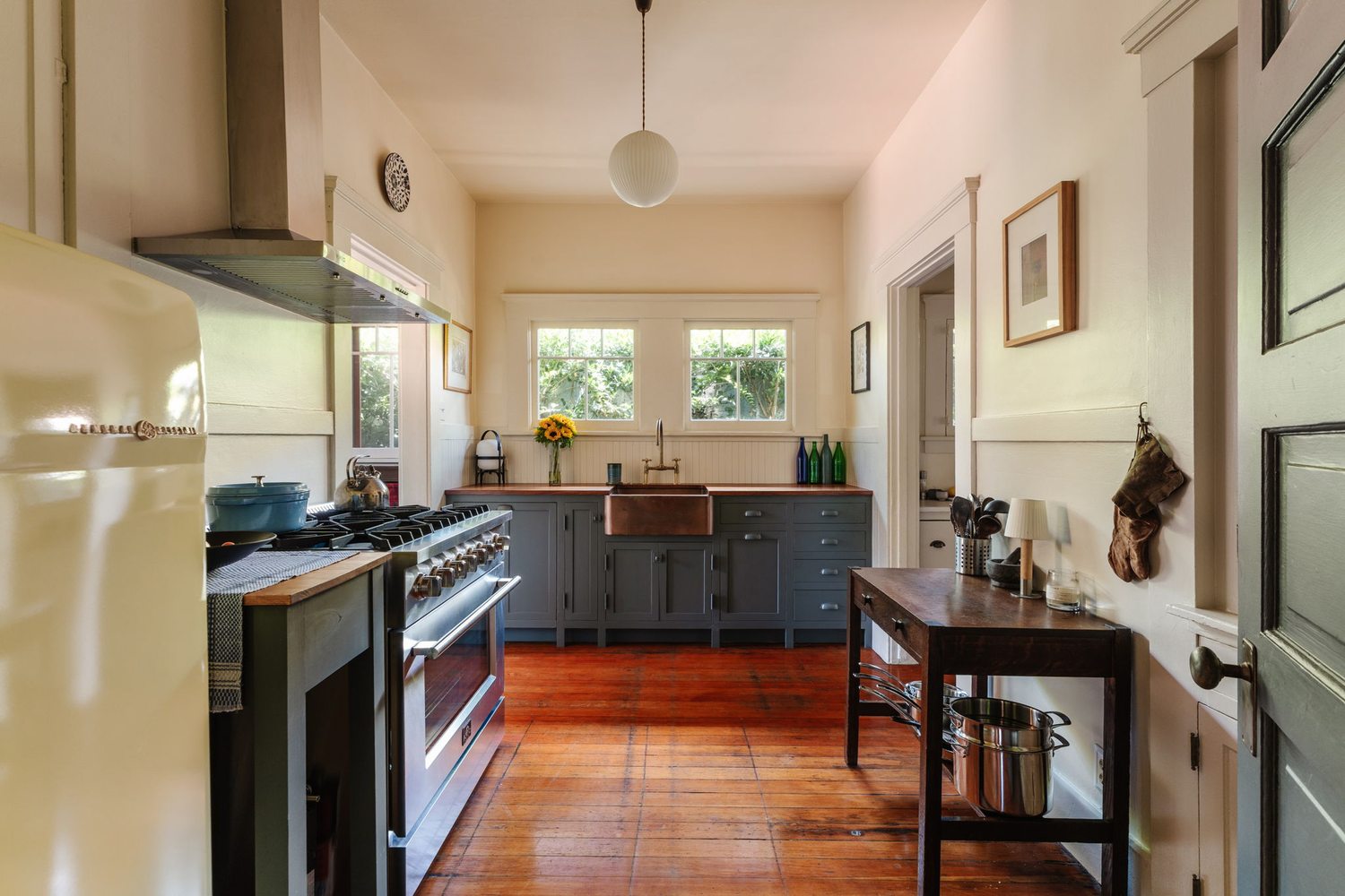 Kitchen of the A.C. Tobias Residence with custom millwork cabinetry and a freestanding range.
