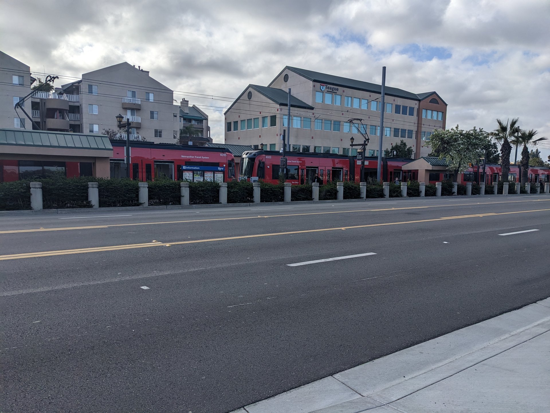 San Diego Trolley cars stopped beside La Mesa Boulevard in La Mesa, uploaded February 2023