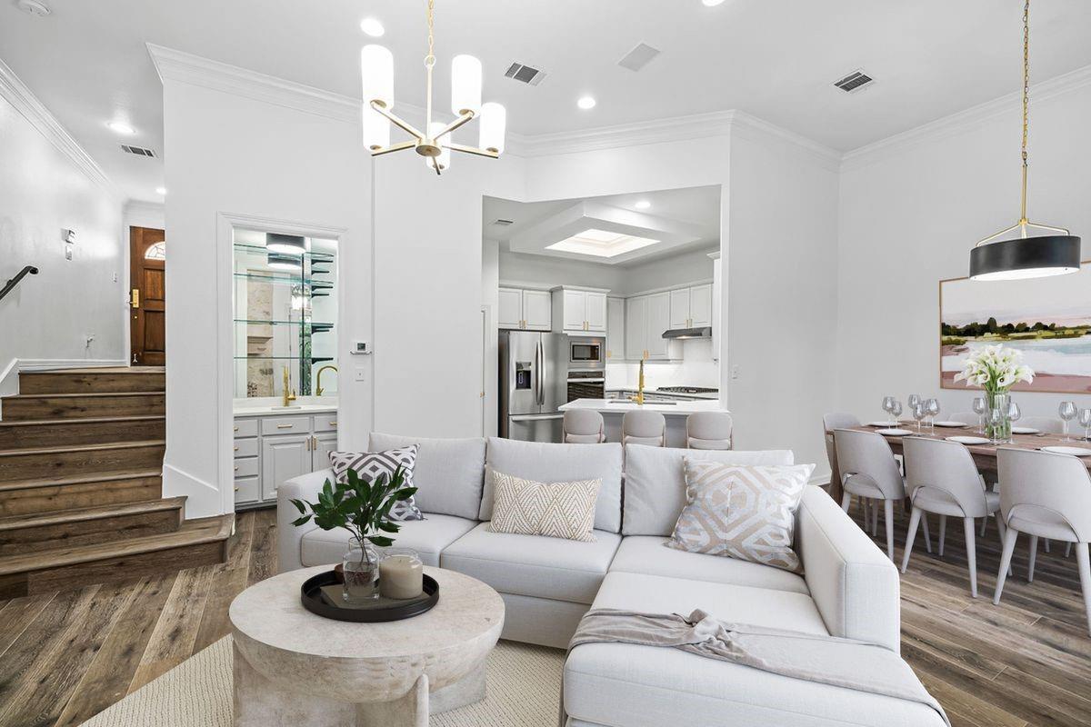 Open-concept living, kitchen, and dining area with staircase, Barton Hollow, Westlake, Austin.