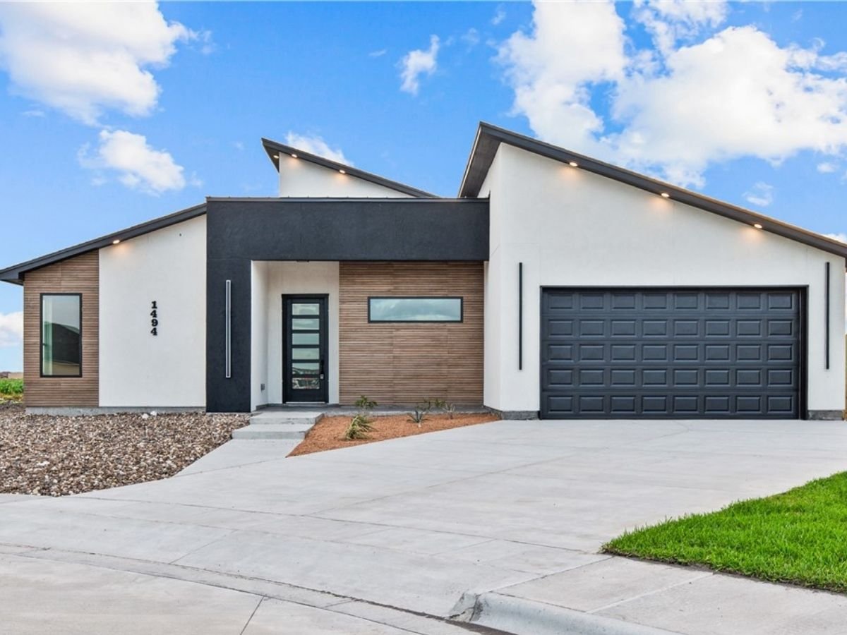 Modern single-story home in Corpus Christi, Texas, with a two-car garage and landscaped front yard.