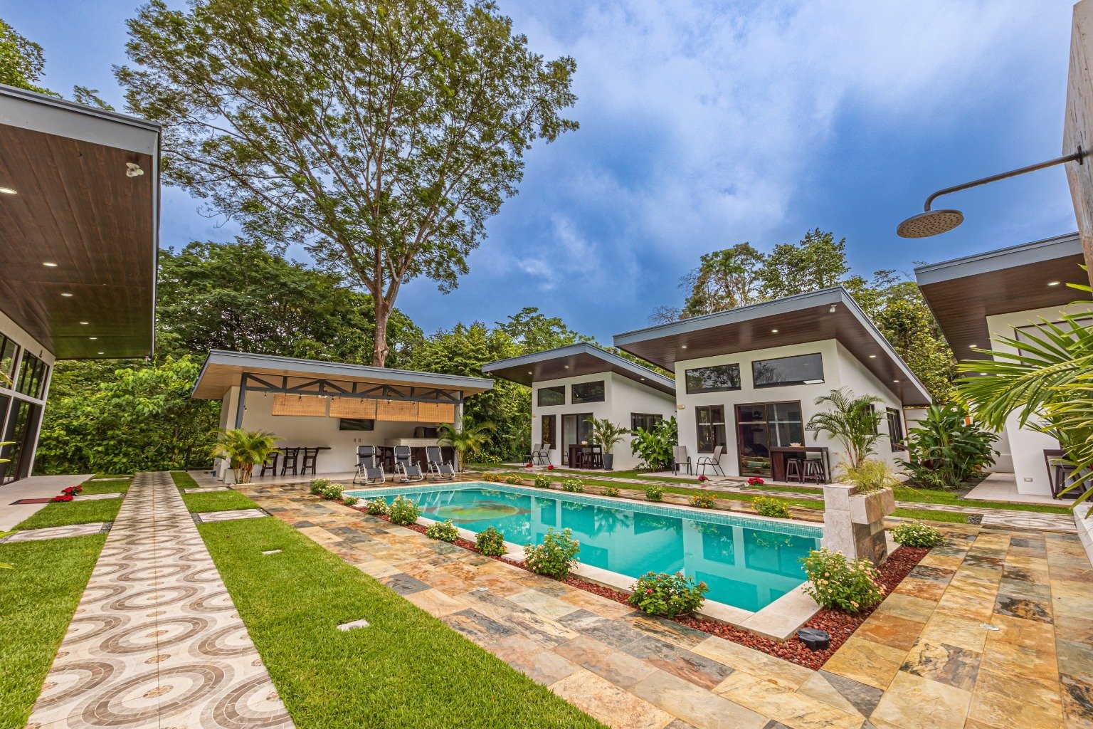 Incredible turnkey investment opportunity, 3 Rental villas, and a 2 Bedroom Home with a large pool.