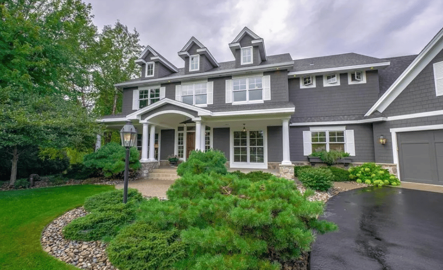 This Gurtek Custom Homes estate offers luxury, privacy, and an easy Twin Cities commute.