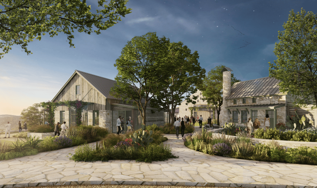 Mirasol Springs gathering area with stone buildings, landscaped paths, and native plants