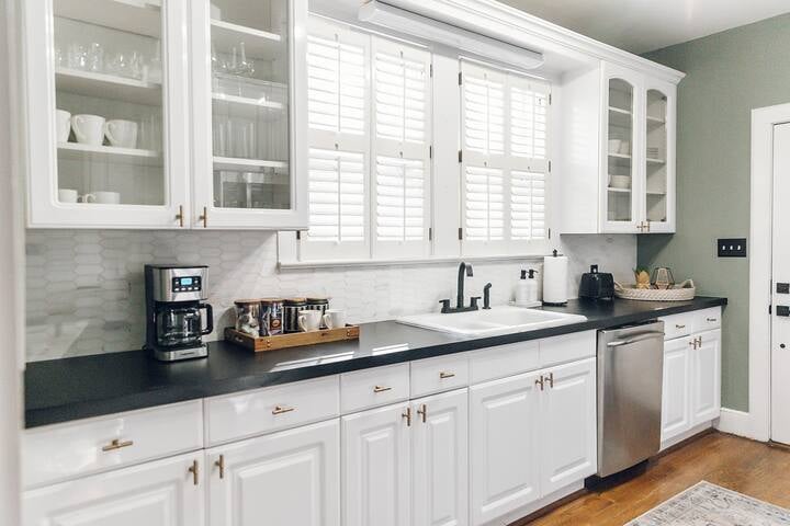 Updated kitchen with modern appliances, white cabinetry, and tile backsplash in 2804 Duncan Street