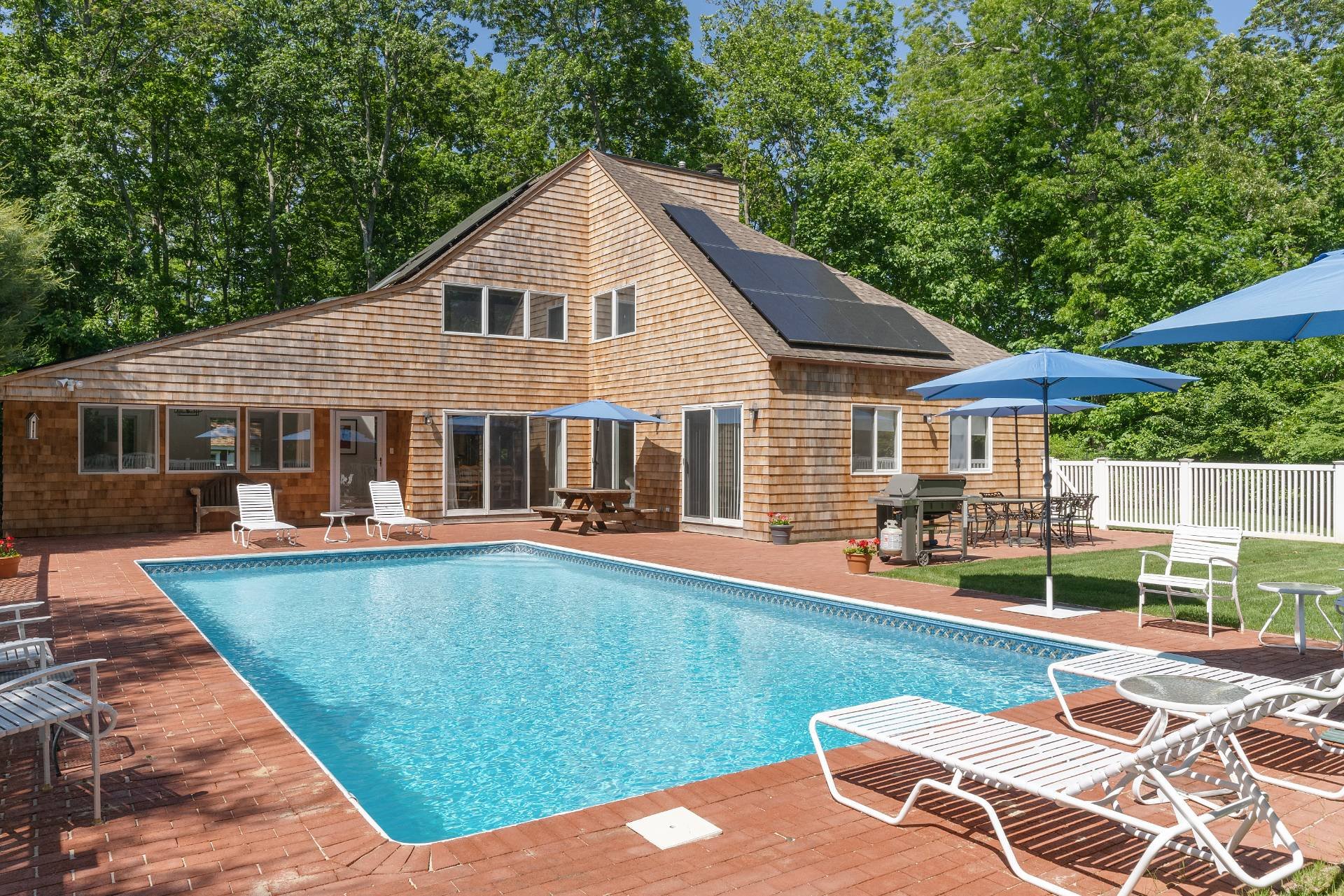 INVITING YEAR-ROUND OR SEASONAL RETREAT WITH HEATED POOL
