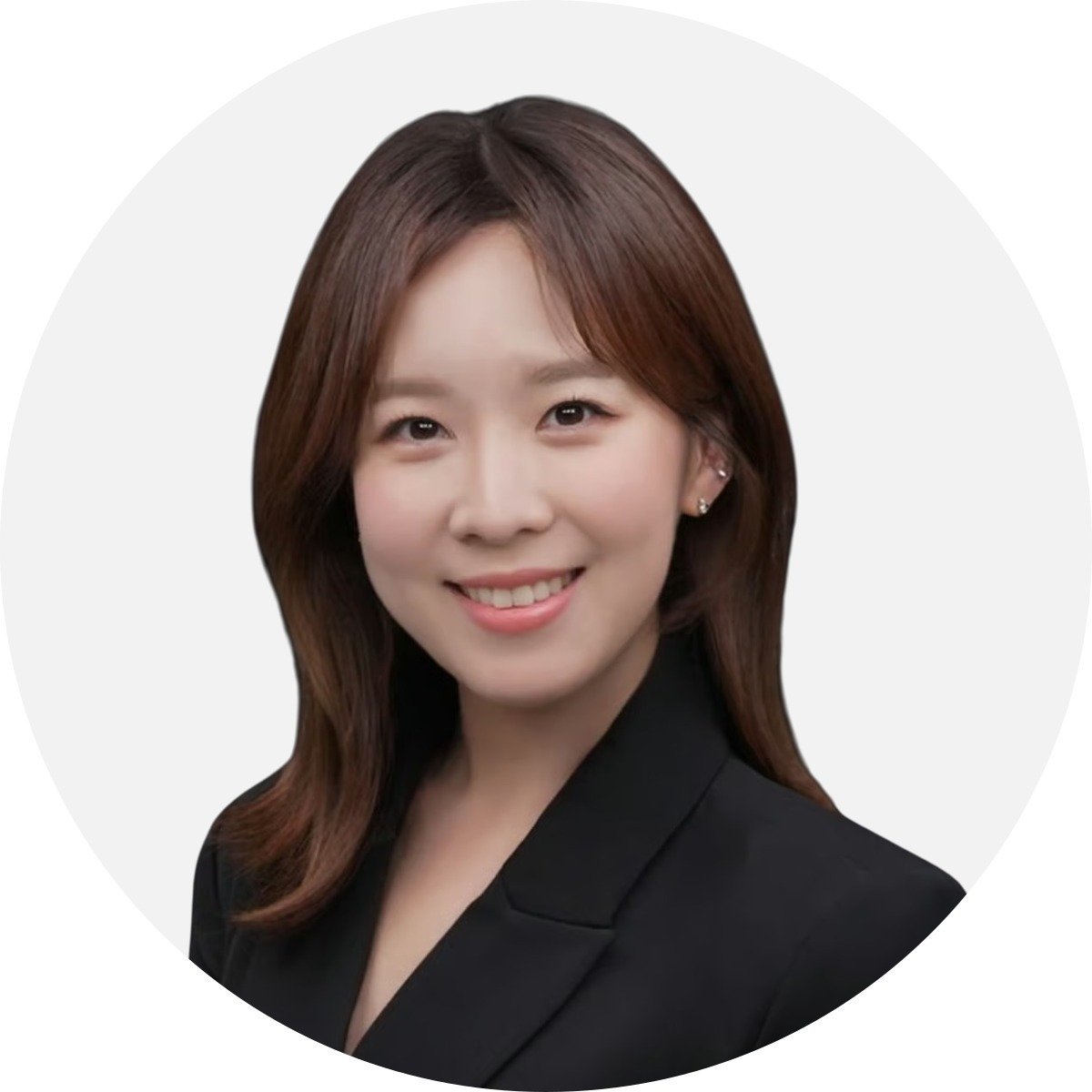 Sungim Roe smiling in a black blazer.