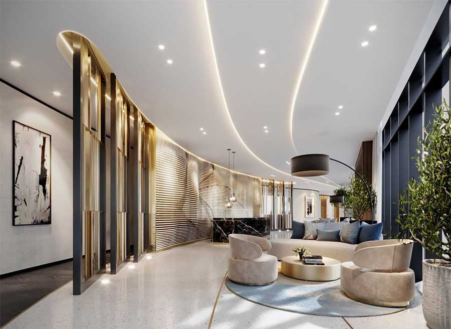 Luxury condominium lobby with a curved gold screen and a furnished lounge beside floor-to-ceiling windows.