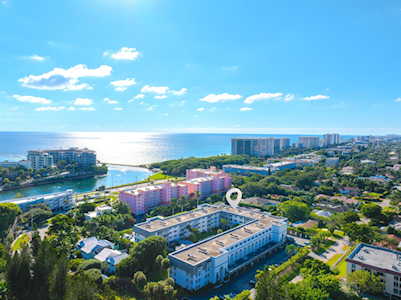 Aerial view of East Boca with the ocean, waterways, and coastal buildings.