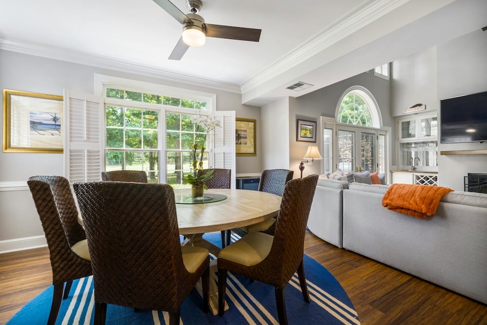 Elegant and well-staged living room with stylish furniture, soft lighting, and thoughtfully arranged decor, creating a warm and inviting ambiance.