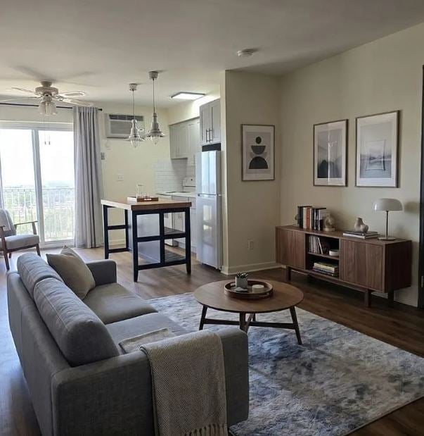Virtually staged bedroom at 201 12th Street Unit 19, Palisades Park, with a large window, gas baseboard heat and a wall air conditioning unit