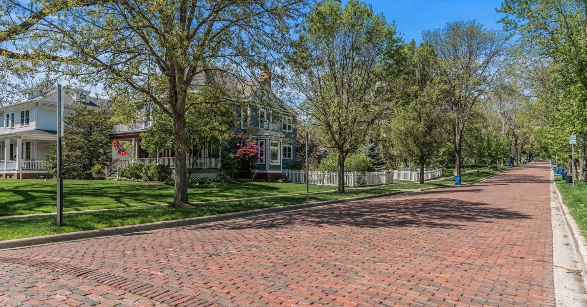 Tree lined residential street in Downers Grove, Illinois, showcasing the type of neighborhood where The Tully Team lists homes for sale.