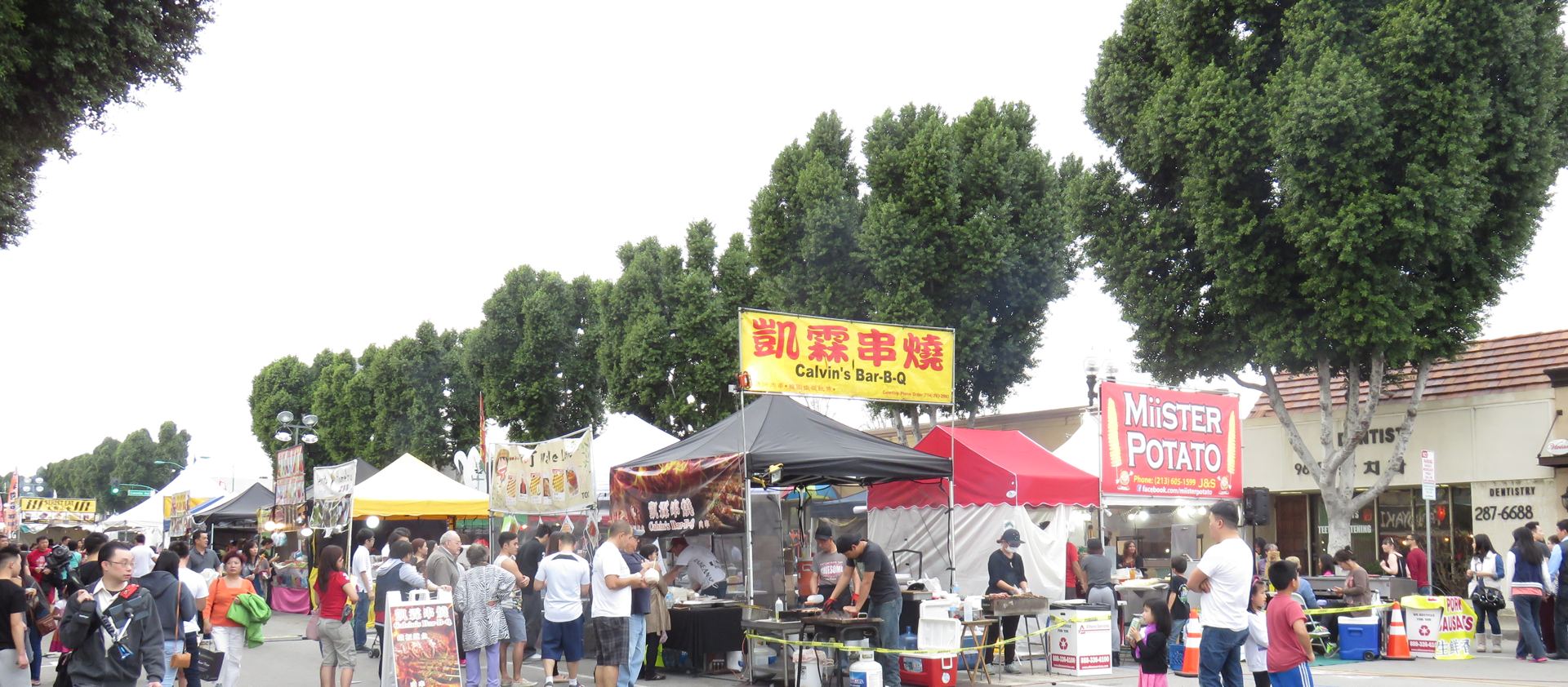 An archival street festival with tents and visitors along Las Tunas Drive in Temple City
