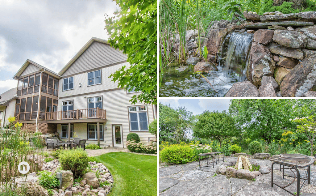 Light-sided home with a screened porch, landscaped gardens, stone waterfall, and patio with a fire pit.