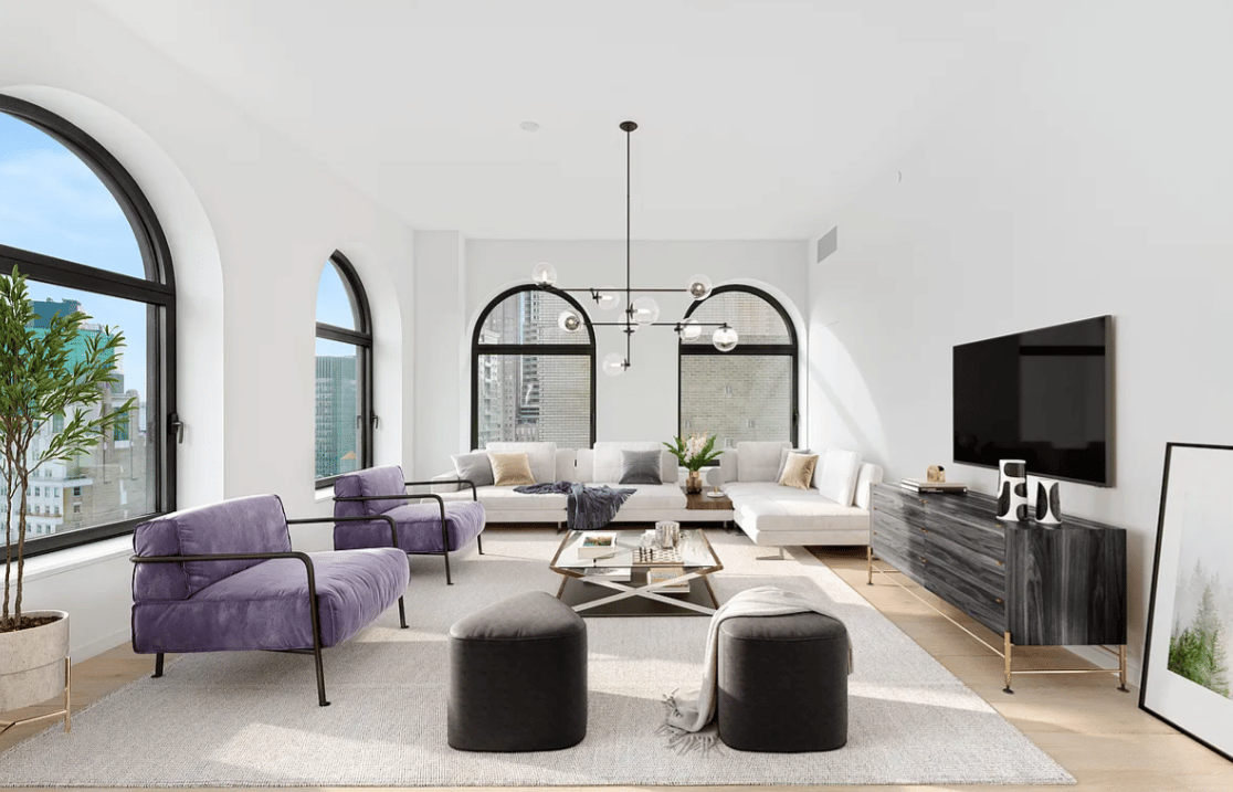 Furnished living room with arched windows, purple chairs, and city views.