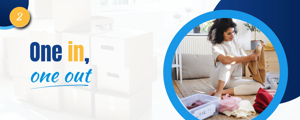 Decluttering tip 2: One in, one out; a woman sorts clothes beside a storage bin.
