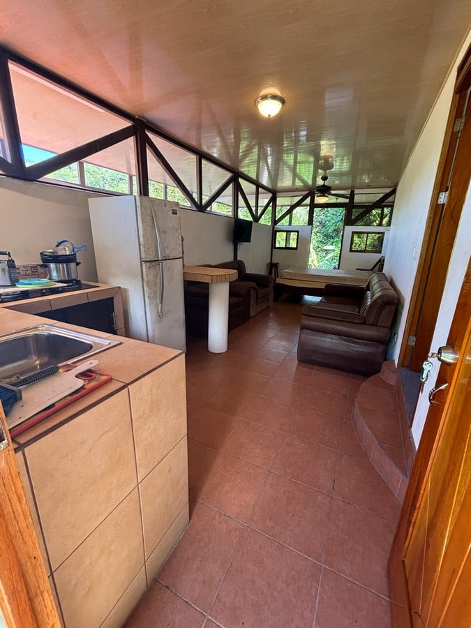 0.16 Acres – 4 Living Units, 7 Bedroom Riverfront Investment Package Near Dominical Beach With Owner Financing!!!
