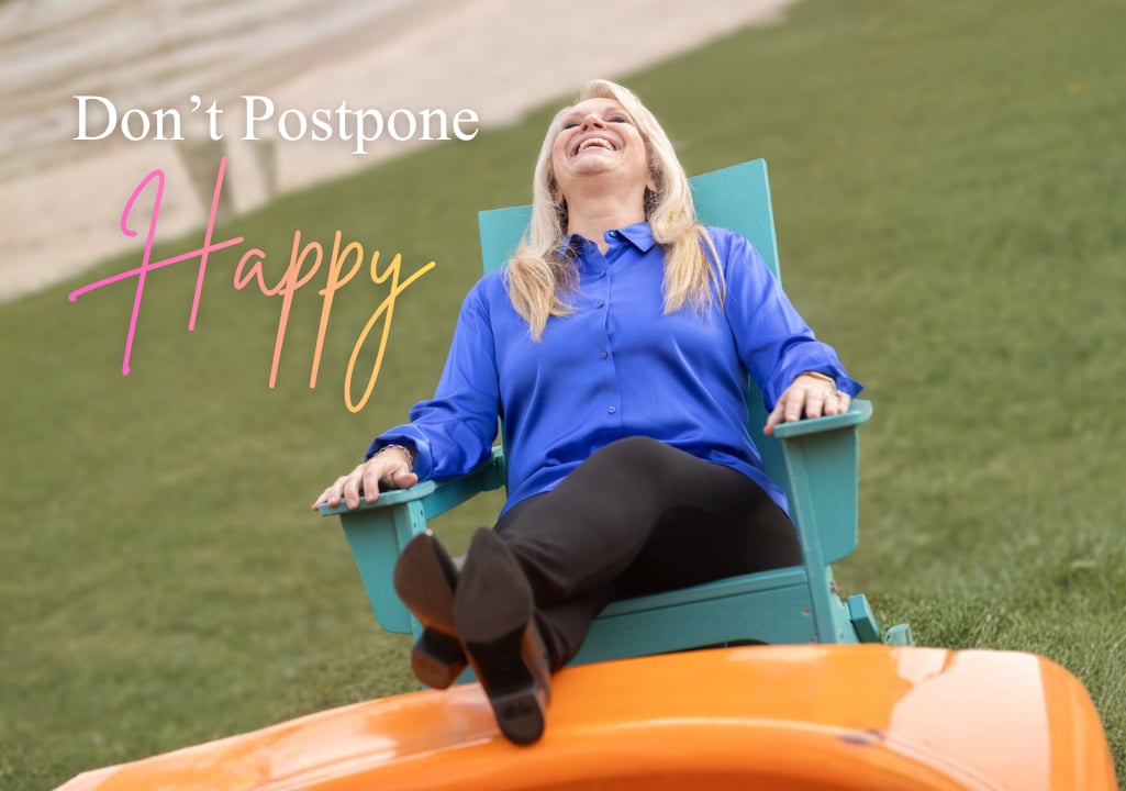 Sharla Ellis laughing and enjoying a happy moment for Happiness Happens Month and her Don’t Postpone Happy blog about finding joy in everyday life.