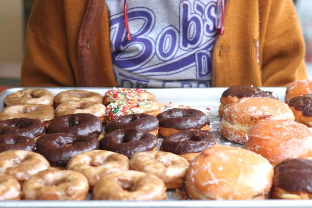 Assortment of glazed and chocolate donuts from Bob's Donuts in San Francisco