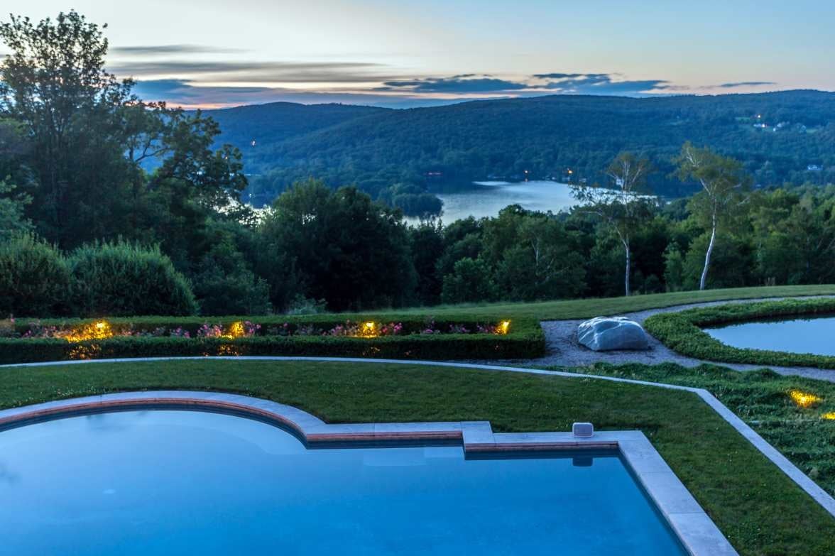 A Modernist Tuscan Villa Perched Above a Pristine Lake in Rural Connecticut - Amenities include a two-story guesthouse, swimming and reflecting pools, and formal gardens