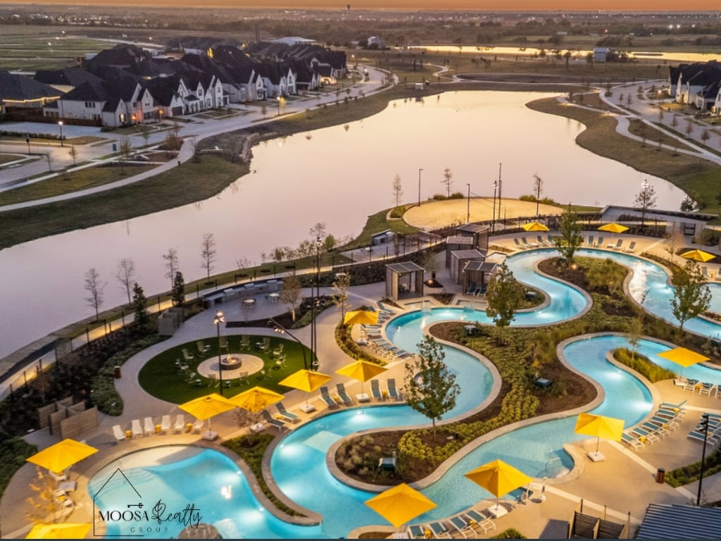 Aerial view of the Mosaic community lazy river and resort-style pool amenities at sunset in Celina, TX — one of the fastest-growing master-planned communities in North DFW.