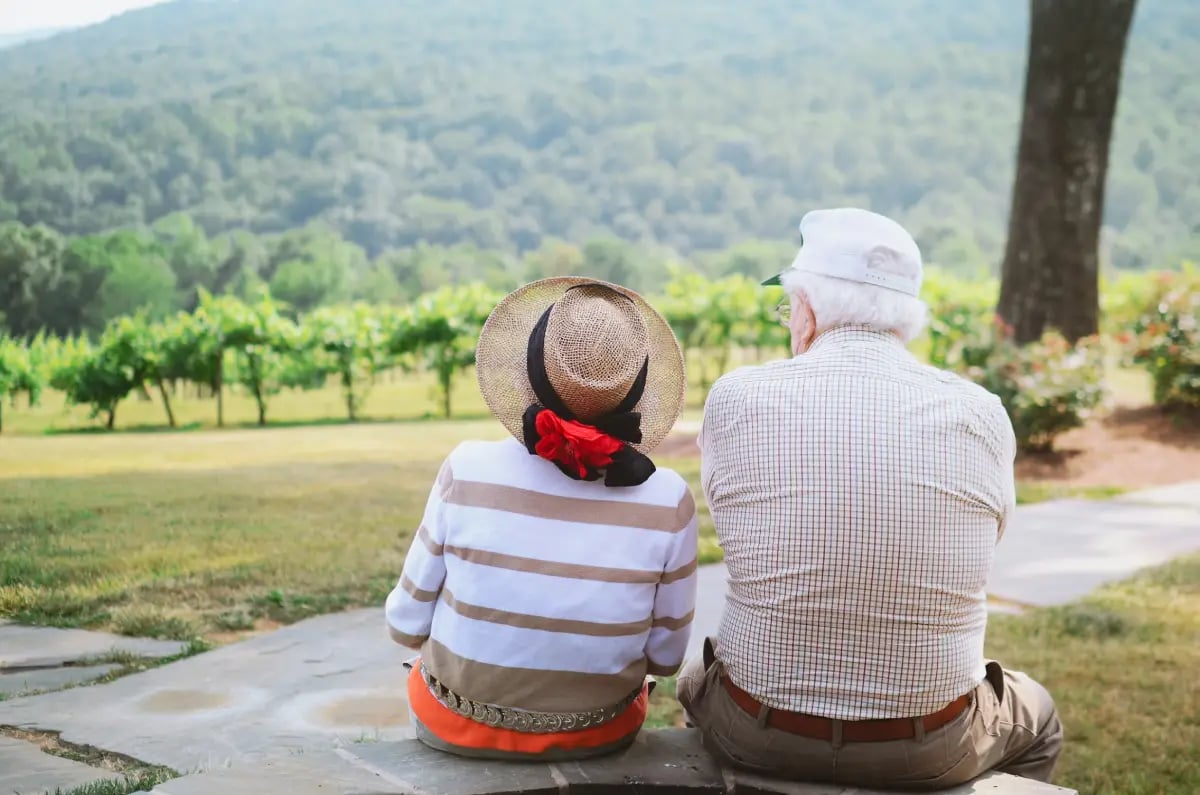 Retired couple enjoying the peaceful outdoor scenery.