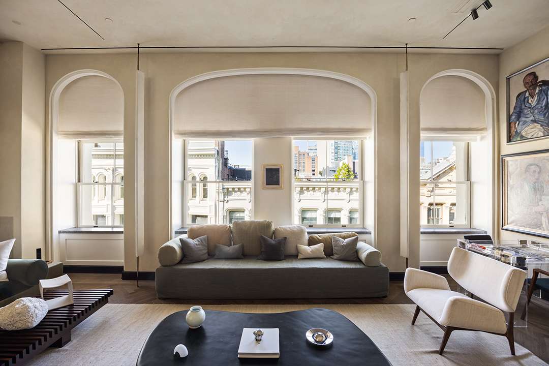 Sixth-floor living space of the $45 million SoHo penthouse featuring oak floors, plastered walls, and custom furnishings by Axel Vervoordt, privately presented by Brendan Brown Real Estate.