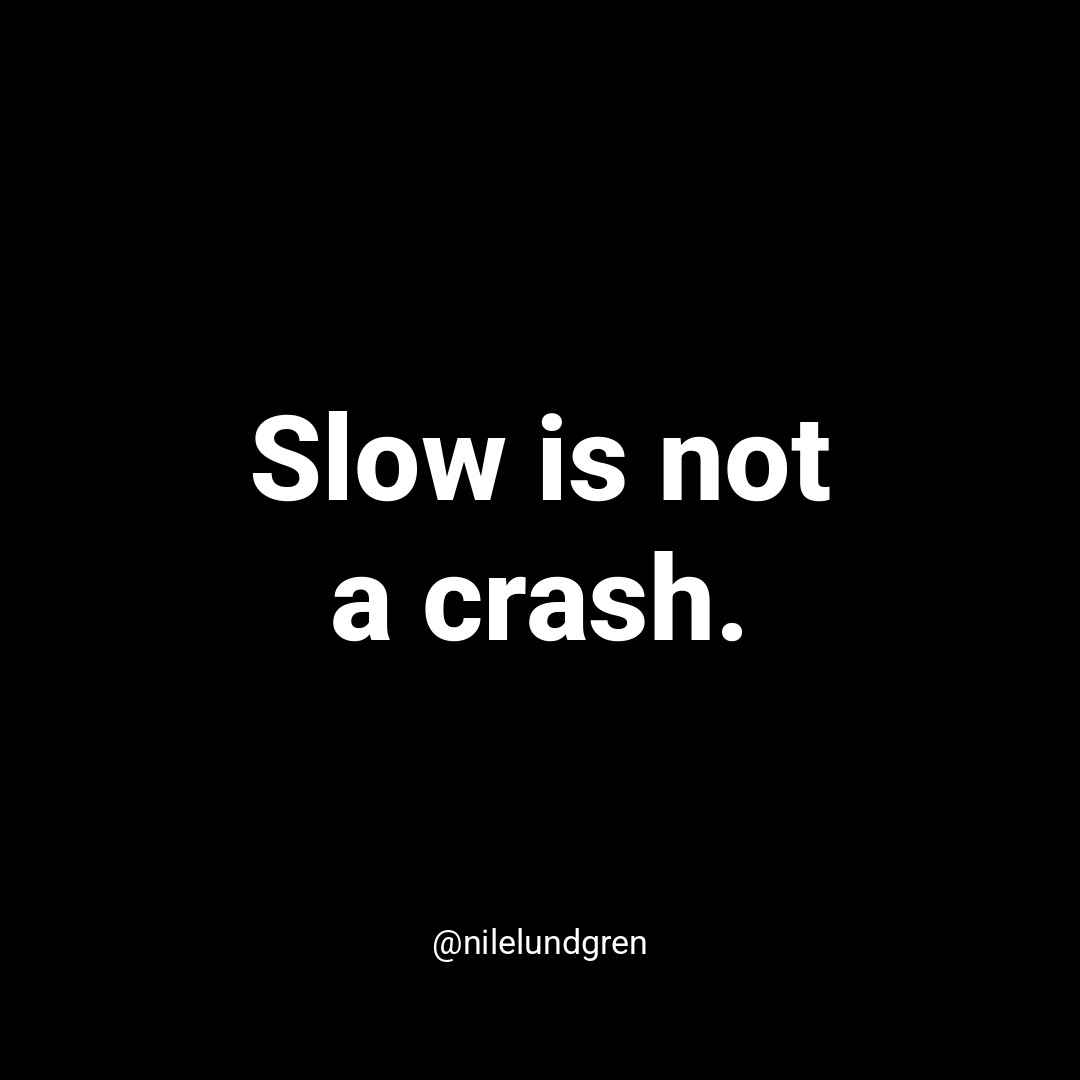 Black and white text card reading Slow is not a crash, with the handle @nilelundgren.