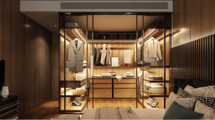 Bedroom with a brightly lit, glass-front walk-in closet and dark wood paneling.
