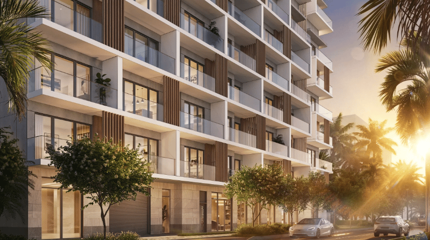 Modern condominium exterior with glass balconies, palm trees, and warm evening light.