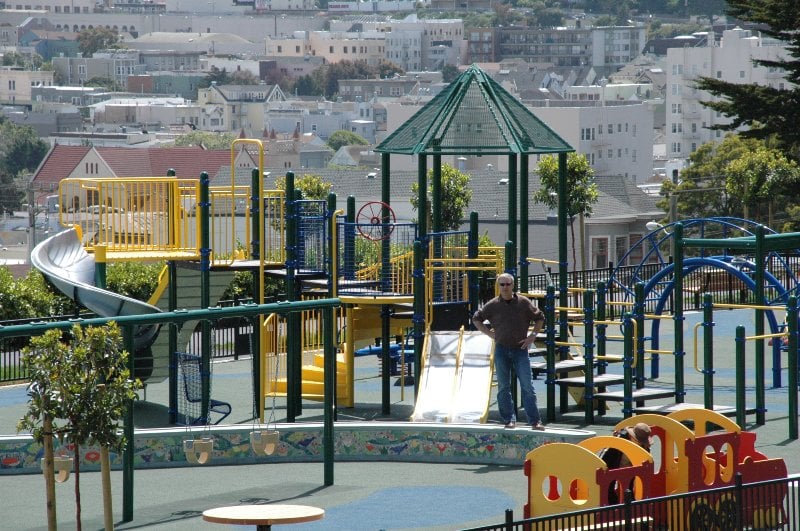 Children's Playground surrounded by greenery at Alta Plaza Park in Pacific Heights, San Francisco.