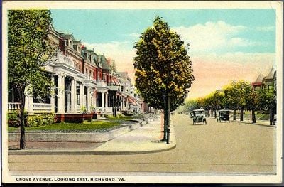 Early twentieth-century postcard view east along Grove Avenue, with houses, trees, and streetcar tracks.