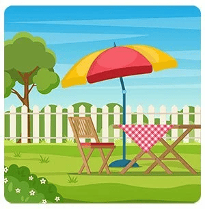 Backyard picnic table under a red-and-yellow umbrella beside a white picket fence.