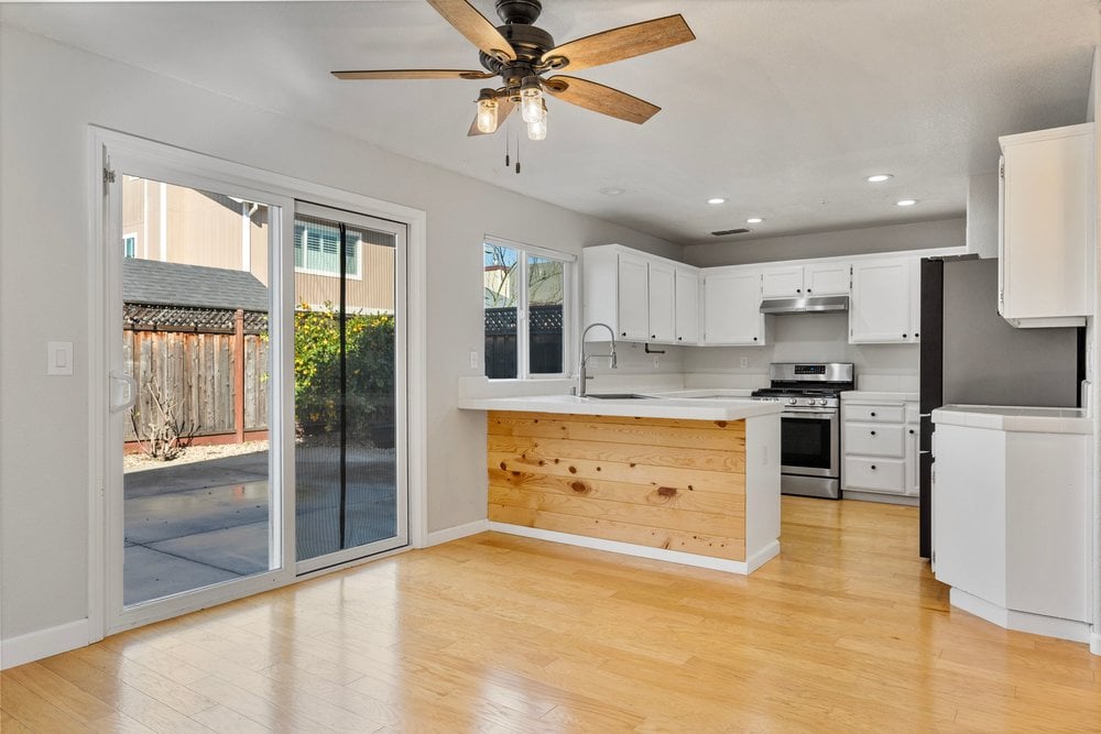 Family-friendly kitchen flowing into living and dining areas