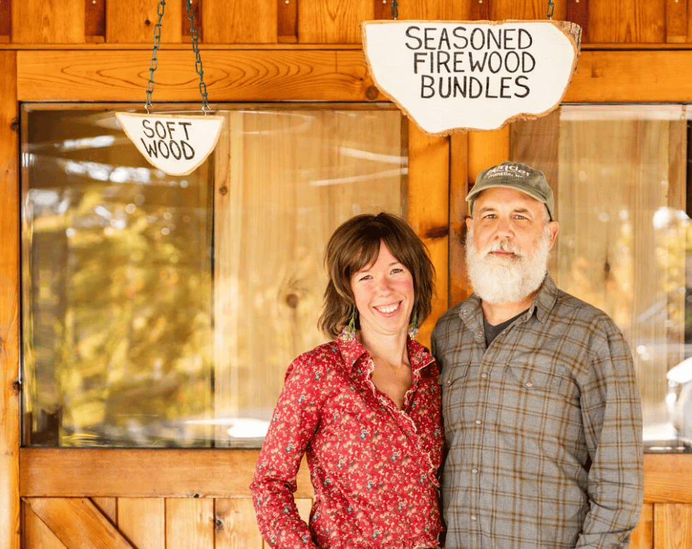 owners of yonder in franklin nc posing in front of their store