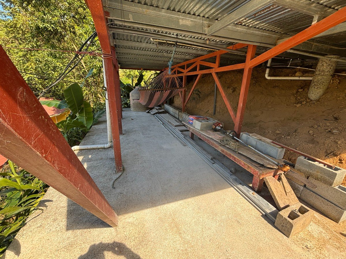0.16 Acres – 4 Living Units, 7 Bedroom Riverfront Investment Package Near Dominical Beach With Owner Financing!!!